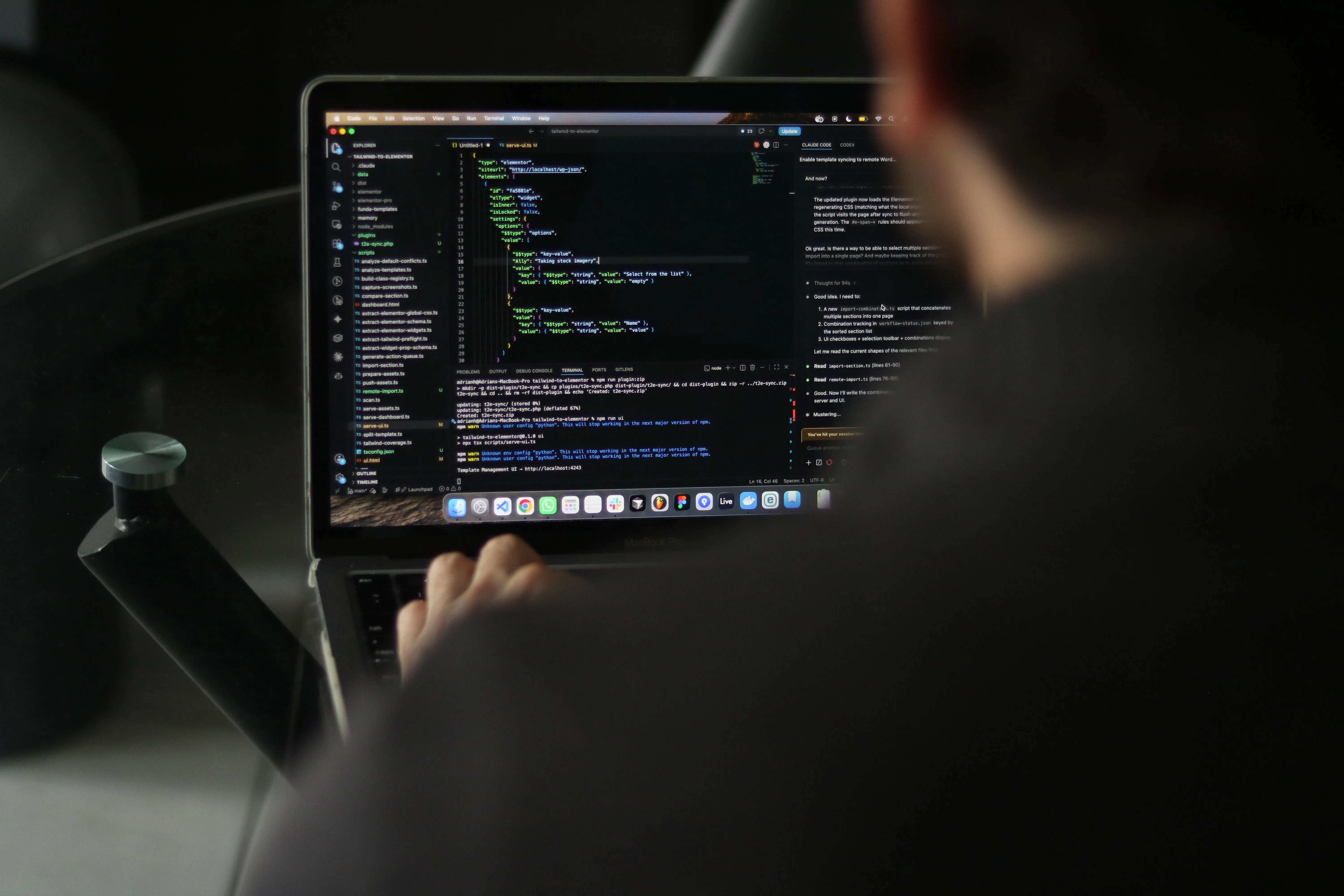 A developer writing code on a laptop beside an AI coding assistant